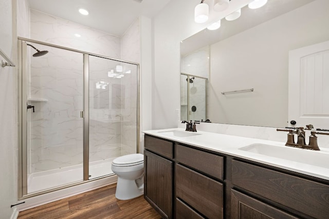 4669 Padula Dr, Round Rock, TX 78665 - bathroom with a marble finish shower, double vanity, and wood finished floors