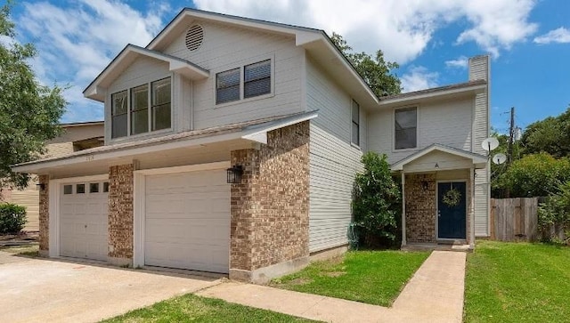 2604 Alcott Ln Unit A & B, Austin, TX 78748 - traditional-style house with a garage, concrete driveway, brick siding, and a chimney