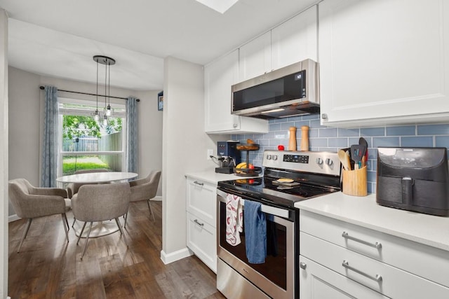 2604 Alcott Ln Unit A & B, Austin, TX 78748 - kitchen with stainless steel appliances, dark wood-type flooring, backsplash, light countertops, and white cabinets