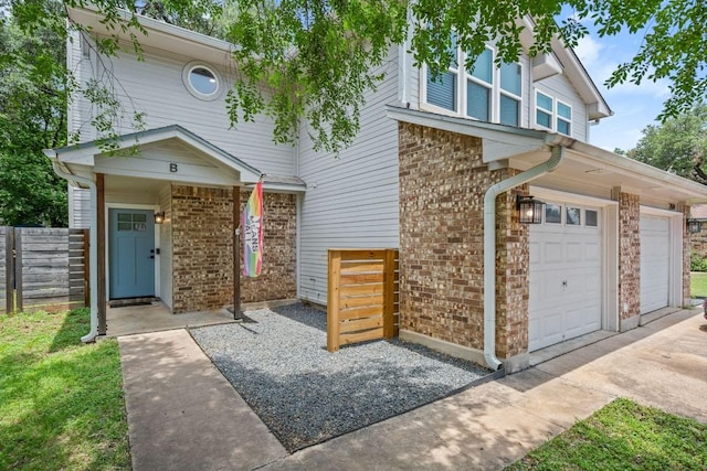 2604 Alcott Ln Unit A & B, Austin, TX 78748 - view of front of home with brick siding, concrete driveway, and an attached garage