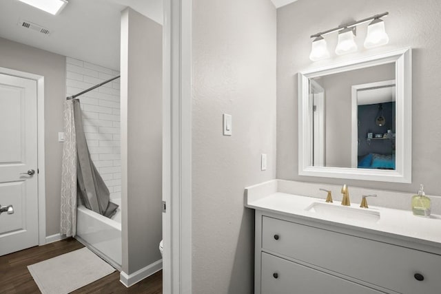 2604 Alcott Ln Unit A & B, Austin, TX 78748 - bathroom with vanity, wood finished floors, and shower / bath combination with curtain
