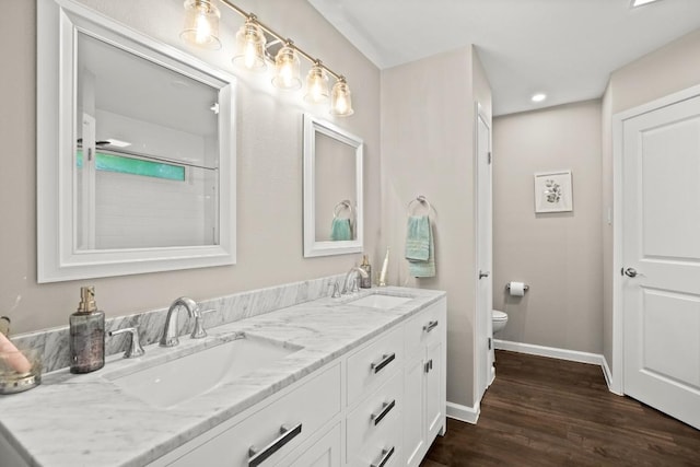 2604 Alcott Ln Unit A & B, Austin, TX 78748 - bathroom with double vanity, wood finished floors, and recessed lighting