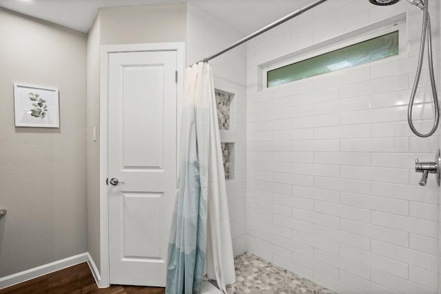 2604 Alcott Ln Unit A & B, Austin, TX 78748 - bathroom featuring a tile shower and baseboards