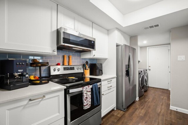 2604 Alcott Ln Unit A & B, Austin, TX 78748 - kitchen with stainless steel appliances, separate washer and dryer, white cabinets, and light countertops