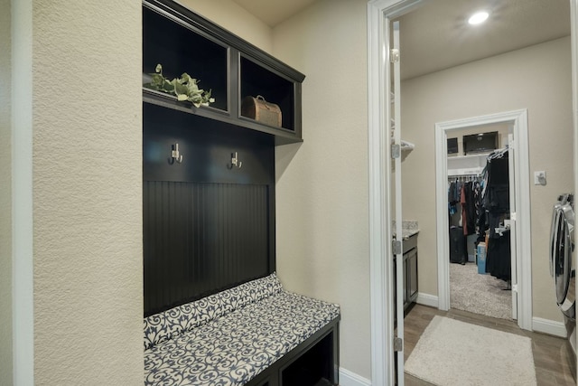 2336 Centennial Loop, Round Rock, TX 78665 - mudroom featuring independent washer and dryer, wood finished floors, and recessed lighting