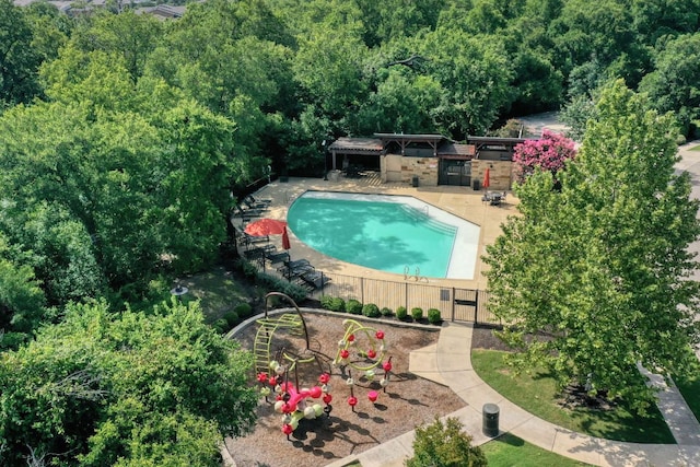 2336 Centennial Loop, Round Rock, TX 78665 - swimming pool with a patio area and a wooded view