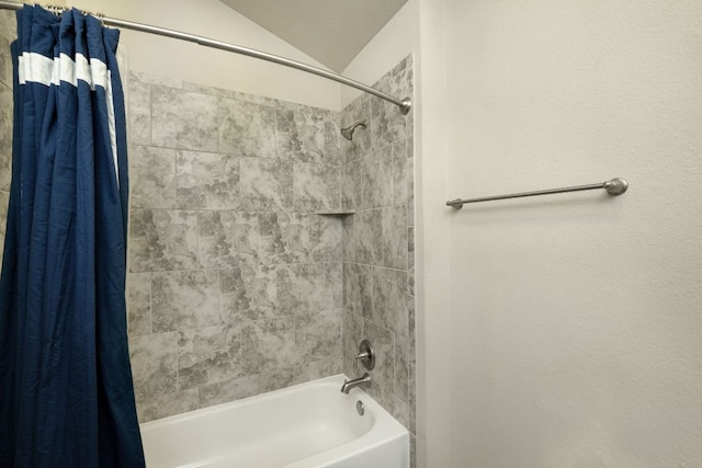 2336 Centennial Loop, Round Rock, TX 78665 - bathroom featuring shower / bath combo and lofted ceiling