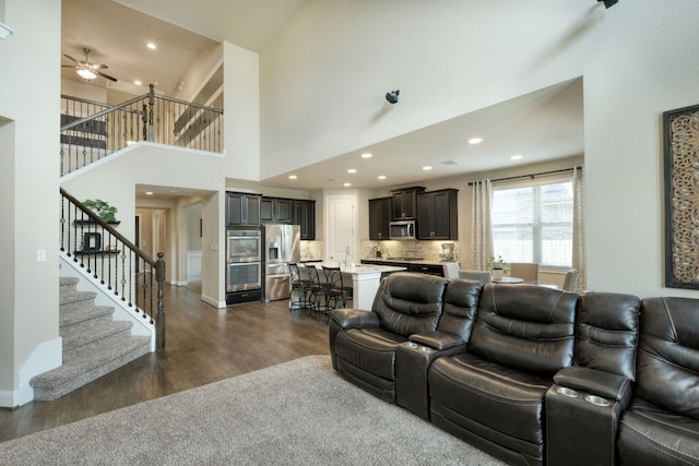2336 Centennial Loop, Round Rock, TX 78665 - living room with dark wood finished floors, stairway, a high ceiling, ceiling fan, and recessed lighting