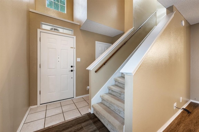 16504 Jadestone Dr, Leander, TX 78641 - entrance foyer with wood finished floors and stairway