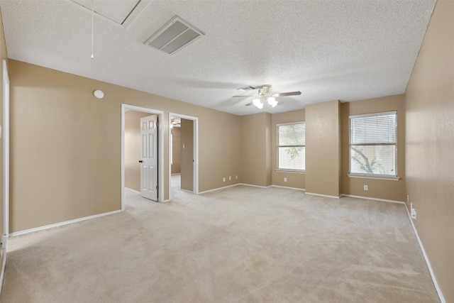 16504 Jadestone Dr, Leander, TX 78641 - unfurnished room featuring attic access, light colored carpet, a textured ceiling, and a ceiling fan