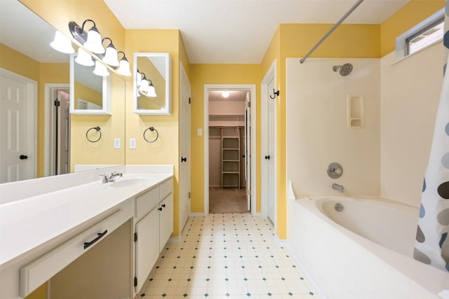 16504 Jadestone Dr, Leander, TX 78641 - bathroom with shower / washtub combination, vanity, tile patterned floors, and a spacious closet