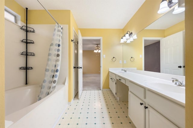 16504 Jadestone Dr, Leander, TX 78641 - bathroom featuring shower / bath combo with shower curtain, double vanity, tile patterned floors, and a ceiling fan