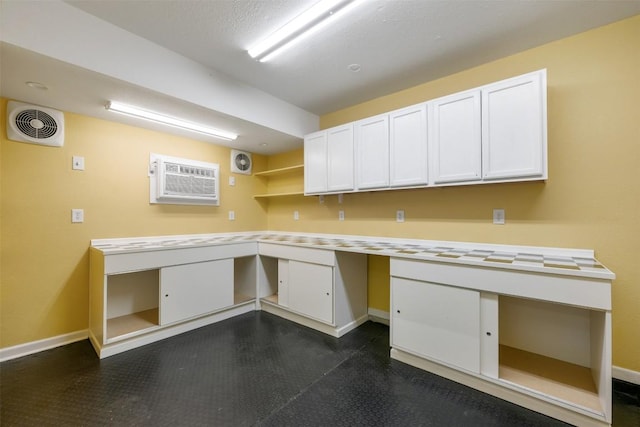 16504 Jadestone Dr, Leander, TX 78641 - unfurnished office featuring built in desk and a wall mounted AC