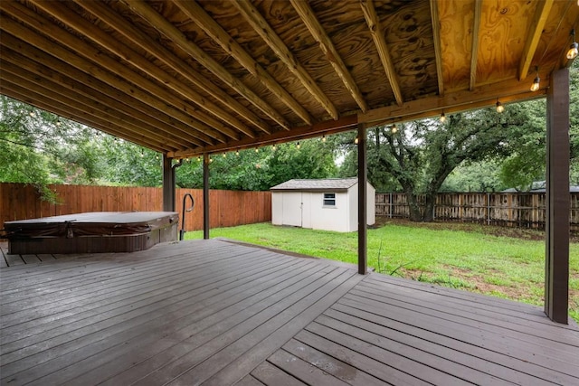 16504 Jadestone Dr, Leander, TX 78641 - deck featuring a covered hot tub, a fenced backyard, and a shed