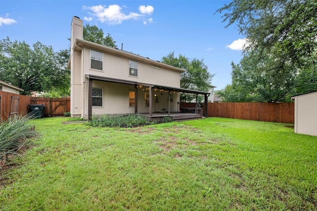16504 Jadestone Dr, Leander, TX 78641 - back of property with a fenced backyard, a chimney, and a patio