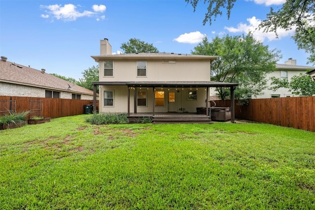 16504 Jadestone Dr, Leander, TX 78641 - rear view of house with a hot tub, a fenced backyard, a chimney, and a deck