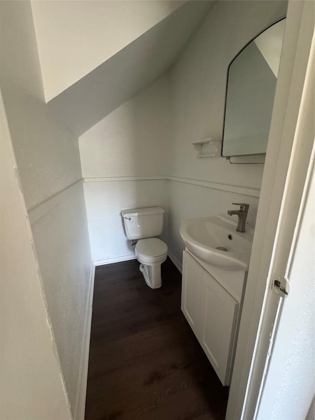 4908 W Gate Blvd, Austin, TX 78745 - bathroom featuring wood finished floors, vanity, and lofted ceiling