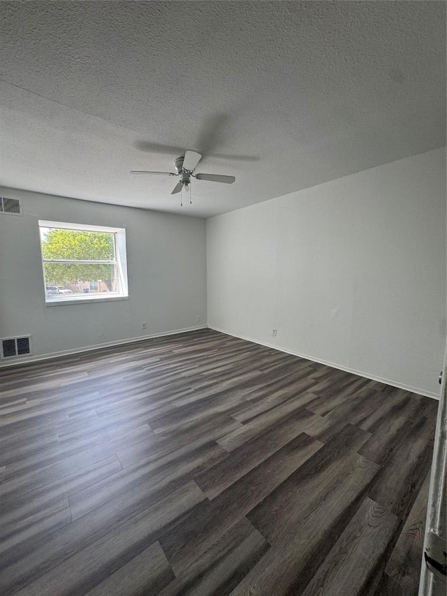 4908 W Gate Blvd, Austin, TX 78745 - unfurnished room featuring dark wood-style flooring, ceiling fan, and a textured ceiling