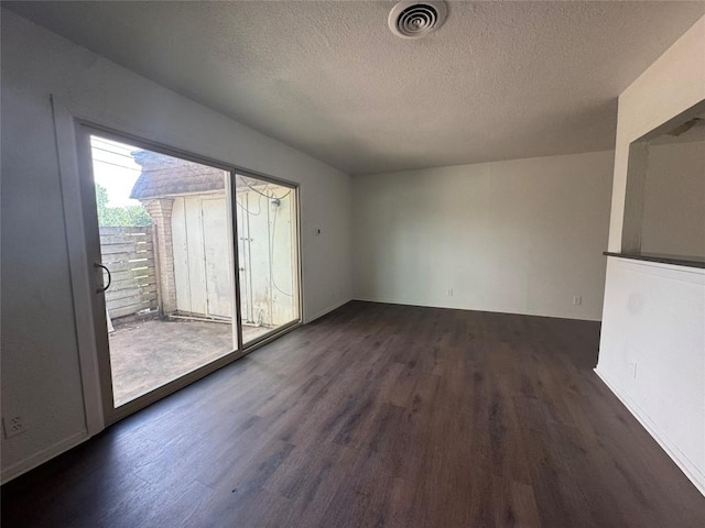 4908 W Gate Blvd, Austin, TX 78745 - unfurnished room featuring dark wood-type flooring and a textured ceiling