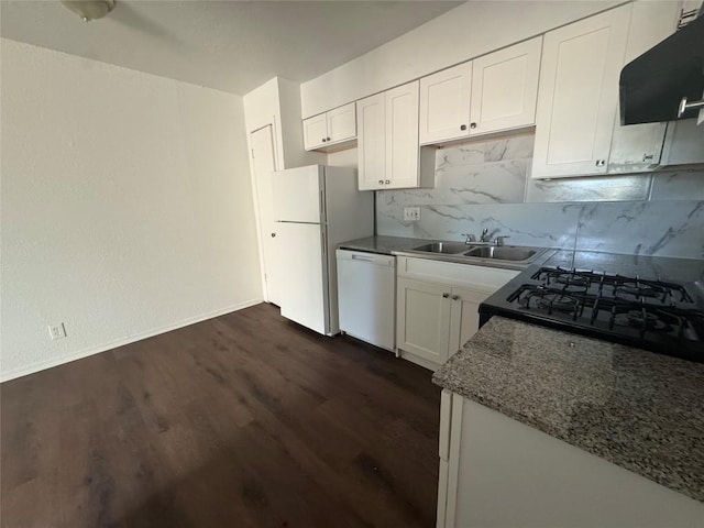 4908 W Gate Blvd, Austin, TX 78745 - kitchen with white appliances, exhaust hood, backsplash, white cabinets, and dark wood-style floors