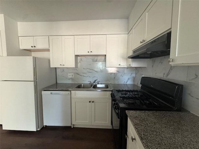 4908 W Gate Blvd, Austin, TX 78745 - kitchen featuring white appliances, under cabinet range hood, white cabinets, dark wood-type flooring, and decorative backsplash