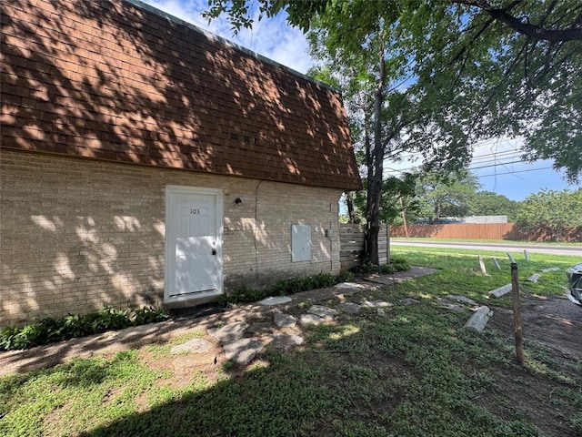 4908 W Gate Blvd, Austin, TX 78745 - view of side of property with brick siding and mansard roof