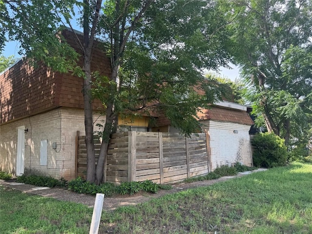 4908 W Gate Blvd, Austin, TX 78745 - view of property exterior with brick siding and mansard roof