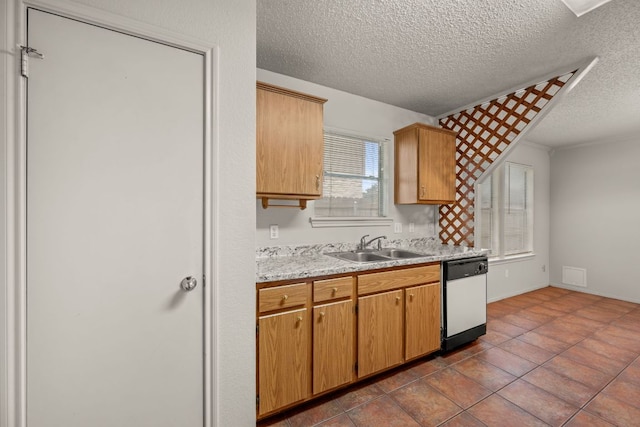 1625 Sylvia Ct, Round Rock, TX 78681 - kitchen featuring white dishwasher, light countertops, and a textured ceiling