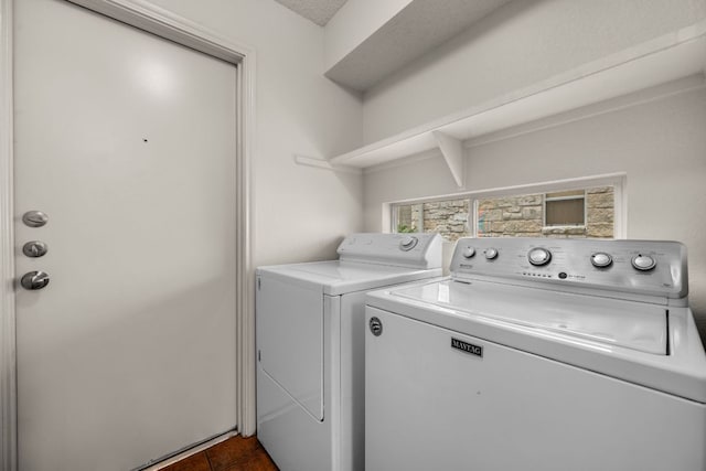 1625 Sylvia Ct, Round Rock, TX 78681 - laundry area with washer and clothes dryer and dark tile patterned floors
