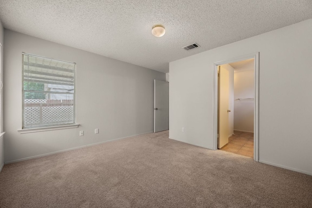 1625 Sylvia Ct, Round Rock, TX 78681 - unfurnished bedroom with light colored carpet and a textured ceiling