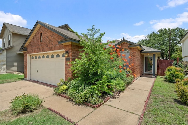 1625 Sylvia Ct, Round Rock, TX 78681 - view of front facade with brick siding and driveway
