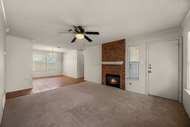 1625 Sylvia Ct, Round Rock, TX 78681 - unfurnished living room with ceiling fan, a textured ceiling, a chandelier, tile patterned floors, and a brick fireplace