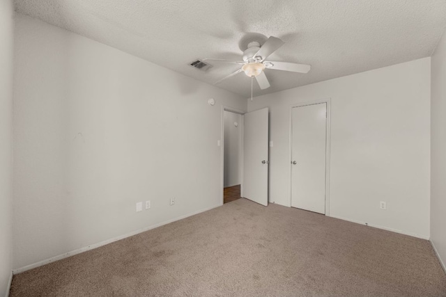1625 Sylvia Ct, Round Rock, TX 78681 - unfurnished bedroom featuring carpet floors, a textured ceiling, ceiling fan, and a closet