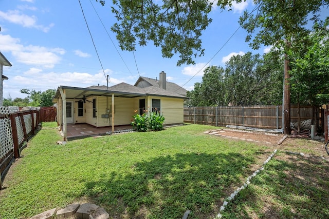 1625 Sylvia Ct, Round Rock, TX 78681 - back of property featuring a chimney, a patio, and a fenced backyard