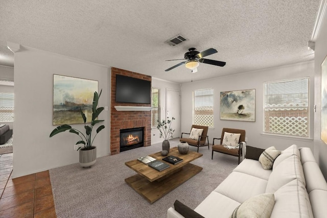1625 Sylvia Ct, Round Rock, TX 78681 - living area with a ceiling fan, a fireplace, and a textured ceiling