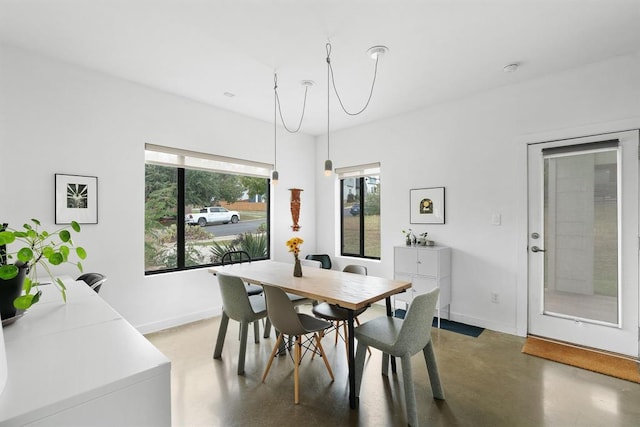 5725 Toscana Ave, Austin, TX 78724 - dining area featuring finished concrete flooring and baseboards