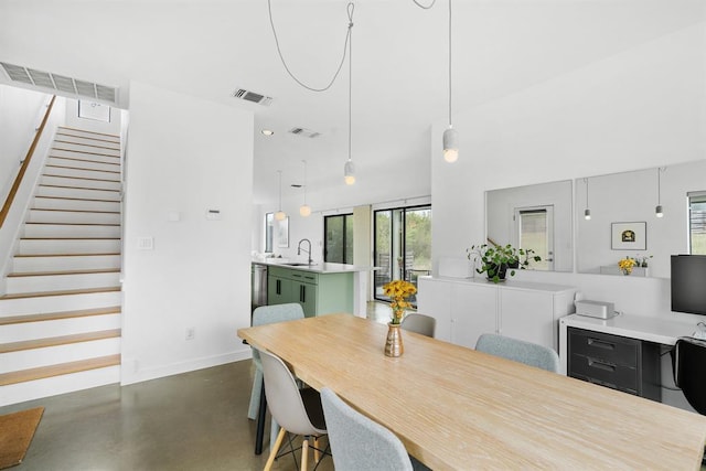 5725 Toscana Ave, Austin, TX 78724 - dining area with concrete floors and stairs