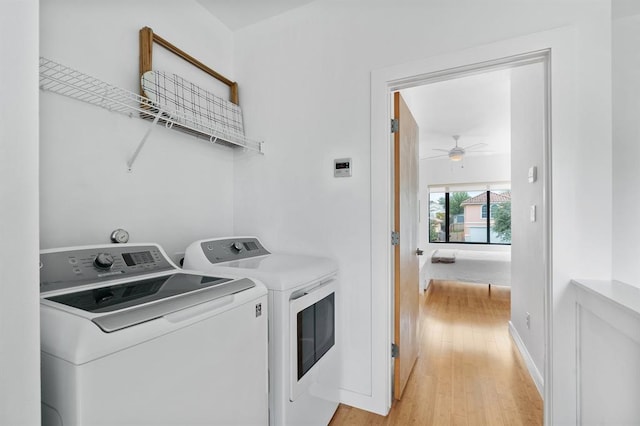5725 Toscana Ave, Austin, TX 78724 - washroom featuring washing machine and dryer, ceiling fan, and light wood-type flooring