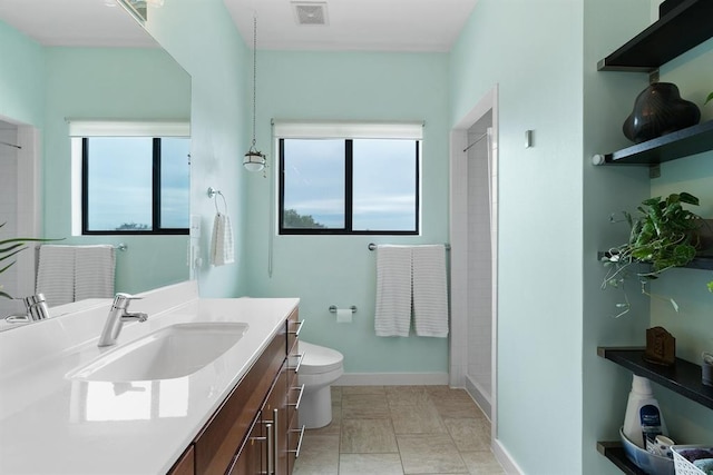 5725 Toscana Ave, Austin, TX 78724 - bathroom featuring vanity, plenty of natural light, and tiled shower