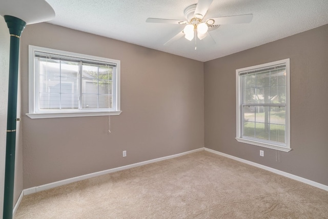 8101 Parkdale Dr, Austin, TX 78757 - empty room with carpet, ceiling fan, and a textured ceiling
