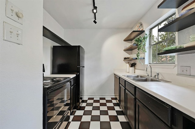 3902 Peterson Ave Unit 203, Austin, TX 78756 - kitchen with electric range, open shelves, dark floors, light countertops, and rail lighting