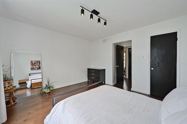 3902 Peterson Ave Unit 203, Austin, TX 78756 - bedroom with wood finished floors and baseboards