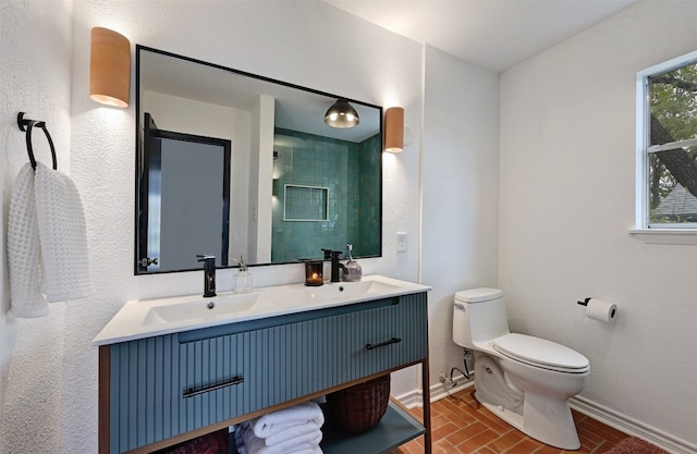3902 Peterson Ave Unit 203, Austin, TX 78756 - full bathroom featuring double vanity, brick patterned flooring, and a shower