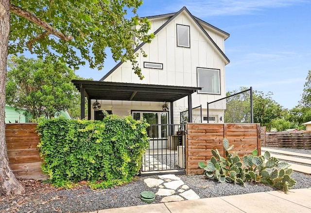 504 Normandy St Unit A, Austin, TX 78745 - view of front of house featuring board and batten siding and a gate