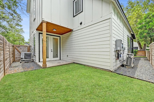 504 Normandy St Unit A, Austin, TX 78745 - rear view of property featuring board and batten siding, a fenced backyard, french doors, and a patio area