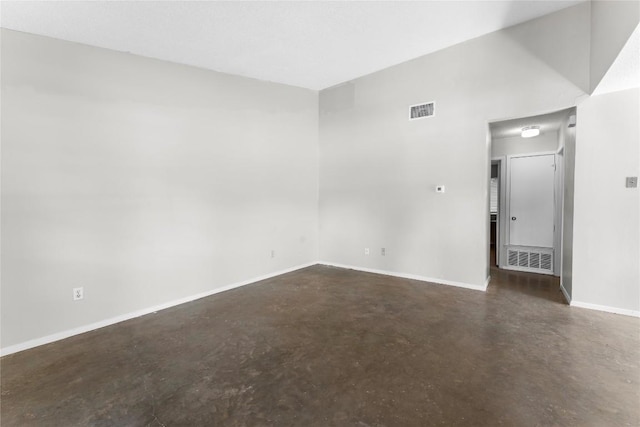 6201 Berkett Cv, Austin, TX 78745 - empty room with finished concrete floors and baseboards