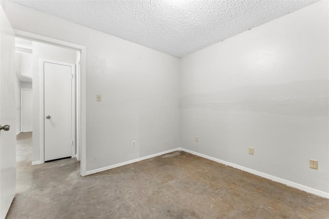 6201 Berkett Cv, Austin, TX 78745 - unfurnished room featuring unfinished concrete flooring and a textured ceiling