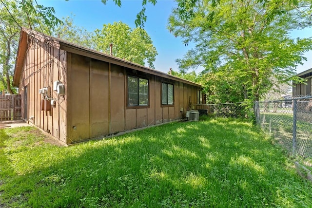 6201 Berkett Cv, Austin, TX 78745 - view of side of home featuring board and batten siding and a fenced backyard