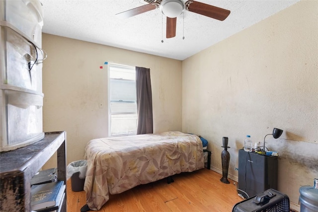 7105 Bethune Ave, Austin, TX 78752 - bedroom featuring wood finished floors and ceiling fan
