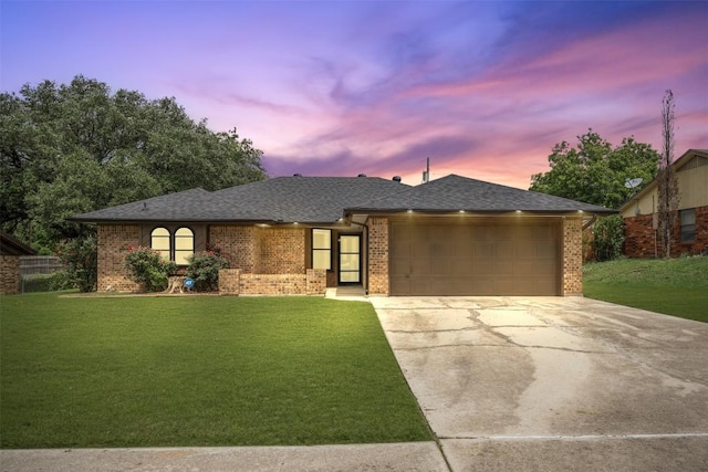 1107 Timmons Dr, Copperas Cove, TX 76522 - ranch-style home with brick siding, a yard, concrete driveway, and a garage